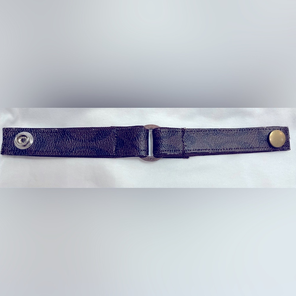 Coach bracelet made from strips of redesigned bag